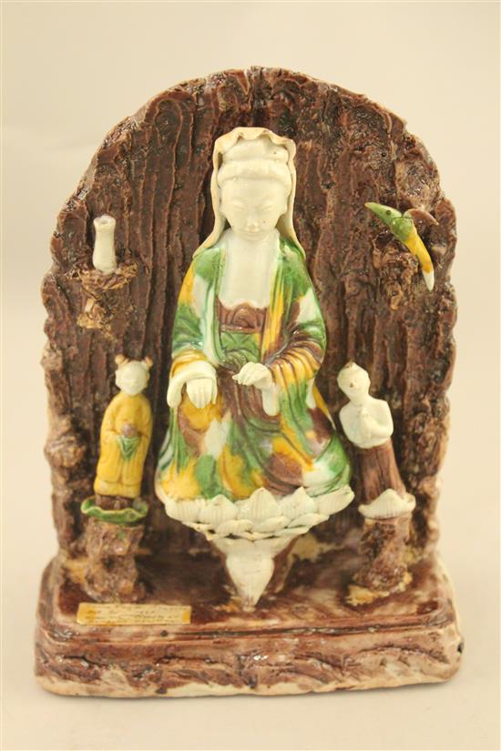 A Chinese Sancai glazed biscuit shrine of Guanyin, Kangxi period, 20.5cm